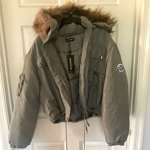PrettyLittleThing khaki cropped fur hooded parka. Size 2 never worn with tags.